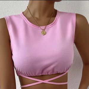 Pink crop top with criss cross at bottom
